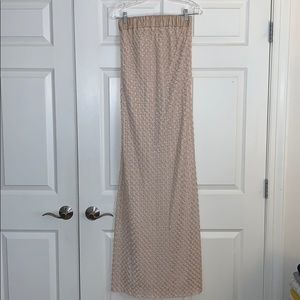 Champagne colored strapless maxi dress.